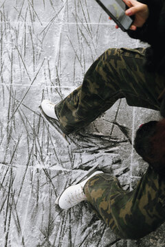 Legs of girl, weared in white ice skates