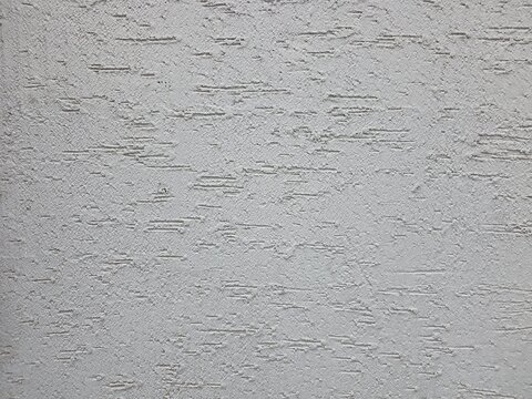 White plaster wall texture with subtle rough pattern background