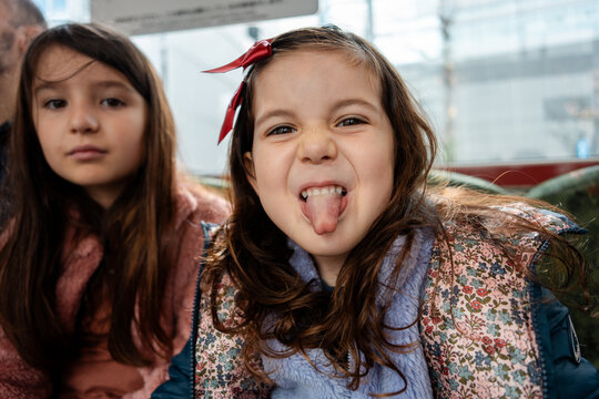 Playful girl sticks out her tongue
