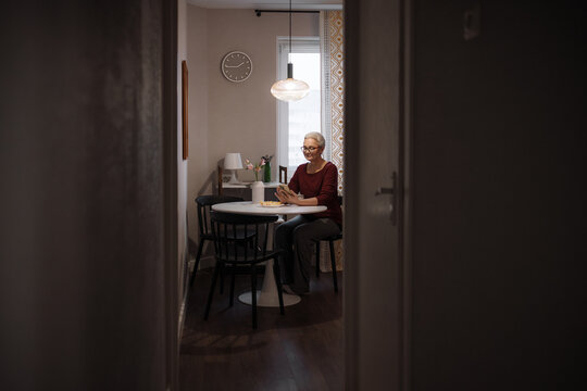 A woman uses a mobile phone 