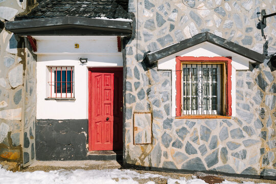 Stone house with red door