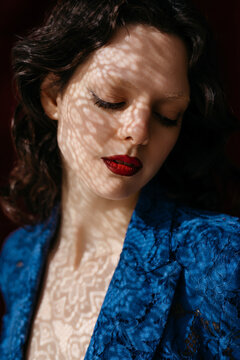 Woman with shadows on face