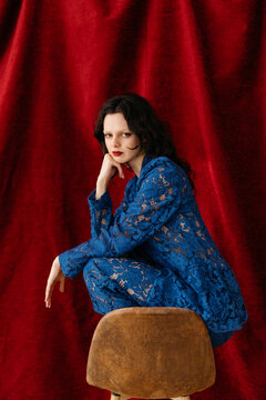 Woman posing on stool
