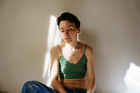 Genderless woman in the bedroom