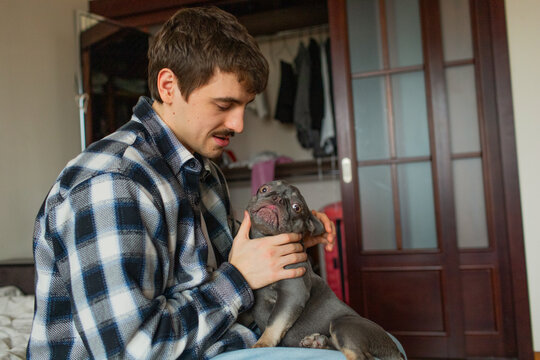 a young man with a dog