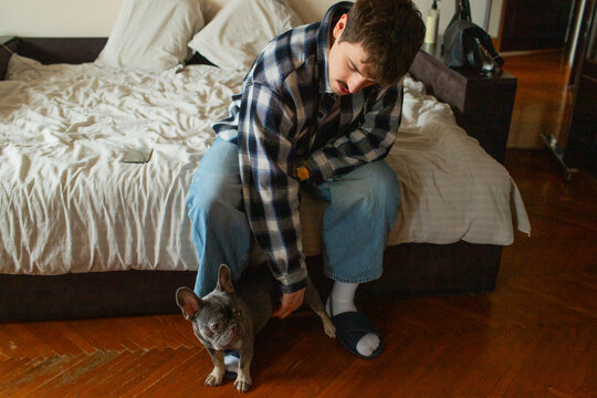 a young man with a dog