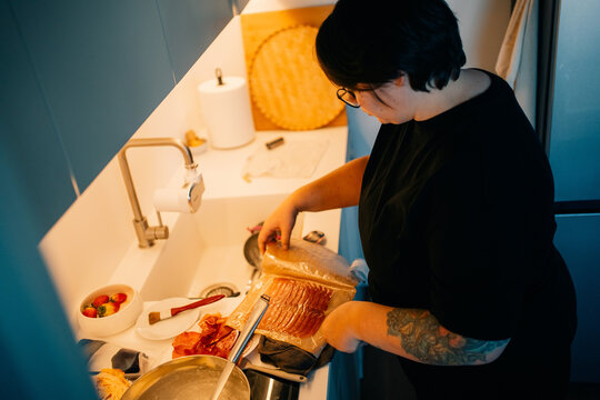 Preparing Food in a Kitchen With Various Ingredients and Utensils
