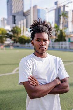 Defiant young athlete with arms crossed