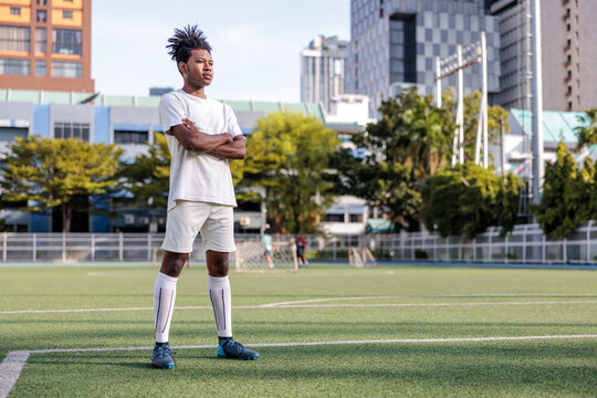 Soccer player confidently standing 
