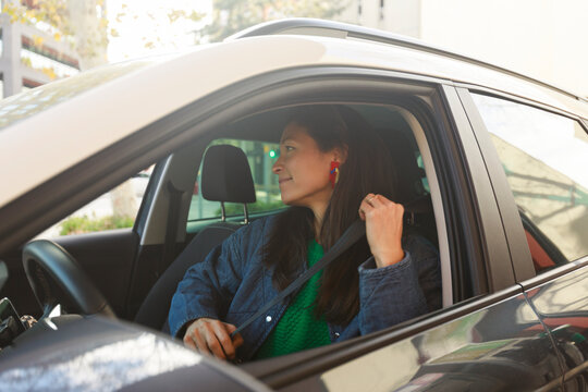 Driver Prepares to Leave Parking Lot in City During Daylight