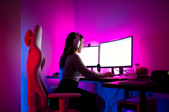 Gaming streamer working at modern desk 