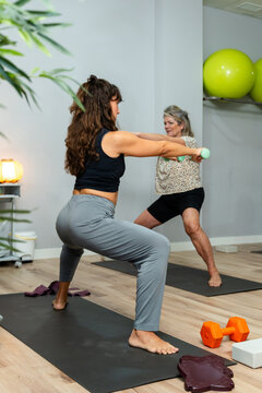 Women exercising with dumbbells in fitness class