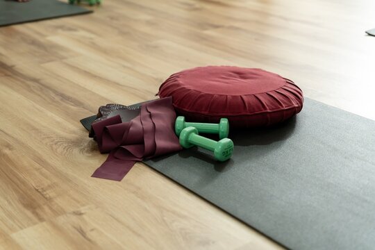 Yoga mat with meditation cushion and fitness equipment
