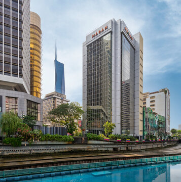 Kuala Lumpur, Malaysia - February 17, 2025: Menara MARAN, Menara Maybank, and Merdeka 118 Tower along the River of Life, showcasing the modern cityscape