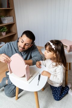 Father And Child At Table