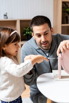 Child Pointing At Furniture
