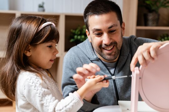 Smiling Father Teaching Child