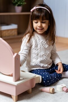 Child Playing With Vanity Set