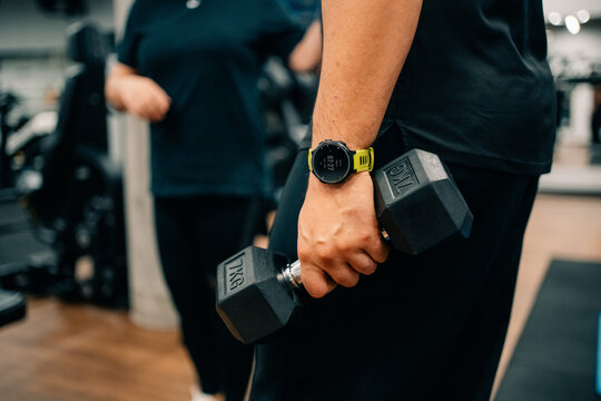 Strength Training Session in Gym With Dumbbell
