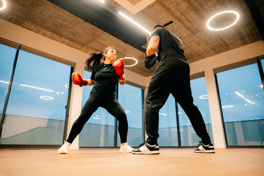 Fitness Training Session in a Gym With Boxing Practice