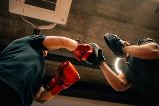 Two People Boxing in a Gym During a Training Session