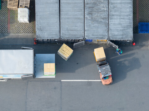 Aerial View of Warehouse Loading Dock with Cargo Trucks