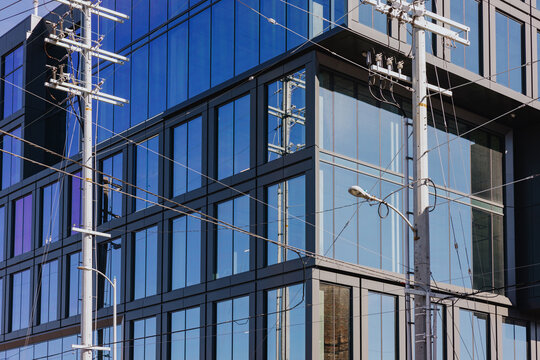 Modern Glass Office Building with Power Lines