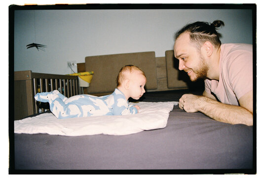 Father and baby share funny moment during playtime