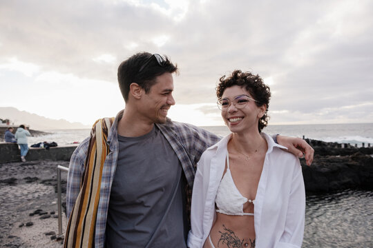 Happy couple enjoying coast vacation in natural pools