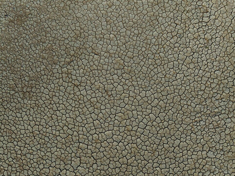 Aerial view of the dry and cracked earth texture of the Manglares de Yucatan salt flats in Chicxulub, Yucatan, Mexico.