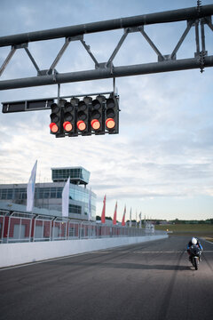 Start lights over racetrack with motorcyclist