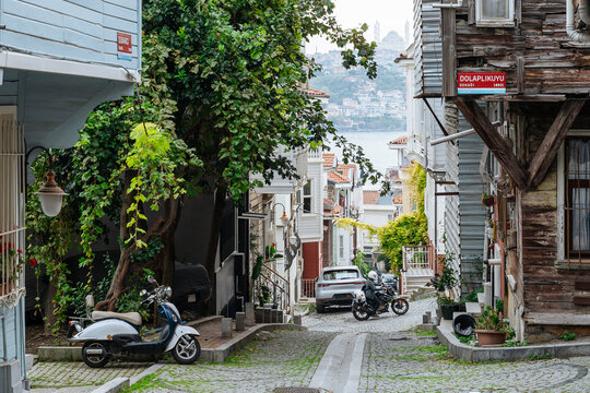 Narrow street with old houses and sea view 