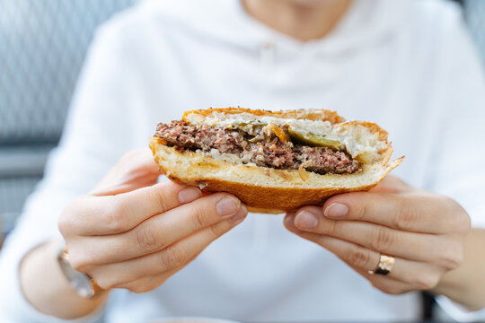 Half-Eaten Beef Burger with Sauce