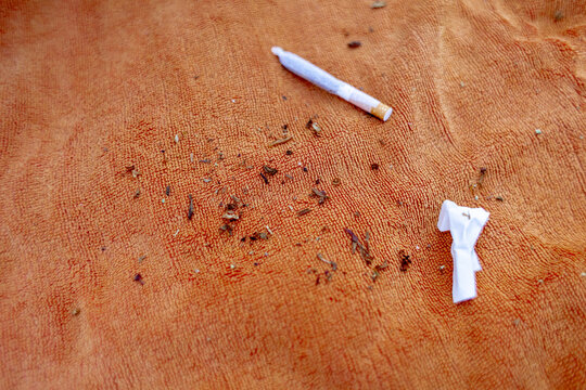 Rolled joint on towel and remains
