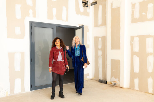 Real estate agent showing commercial space to potential client