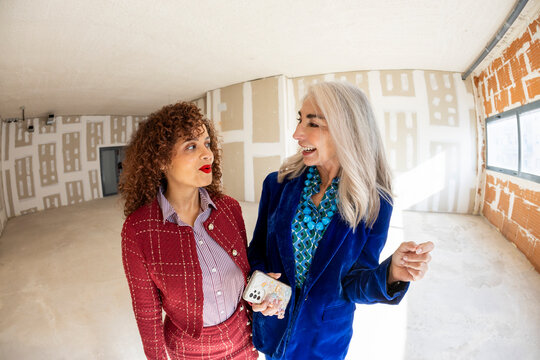 Interior designer team discussing options for apartment renovation. 