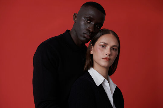 portrait of brunette woman and black man