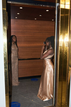 Girls Take Pictures in Elevator