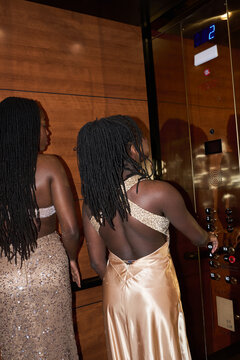 Two Women Enter an Elevator