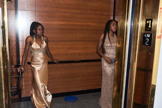 Two Women Waiting in Elevator