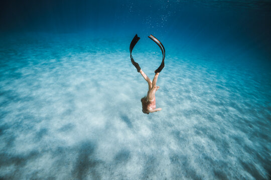 Woman freediving peacefully in crystal clear Mediterranean water