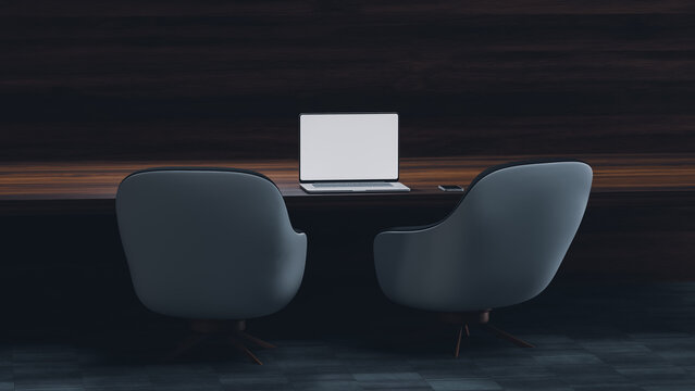 Modern workspace with laptop and chairs at a desk in an office