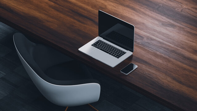 Modern desk setup with laptop and chair in a workspace