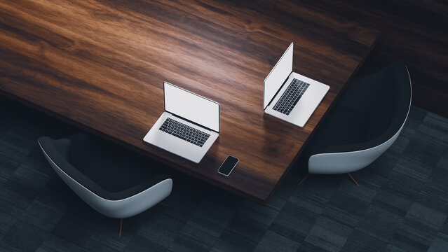 Work setup with laptops, chairs, and table in modern interior design