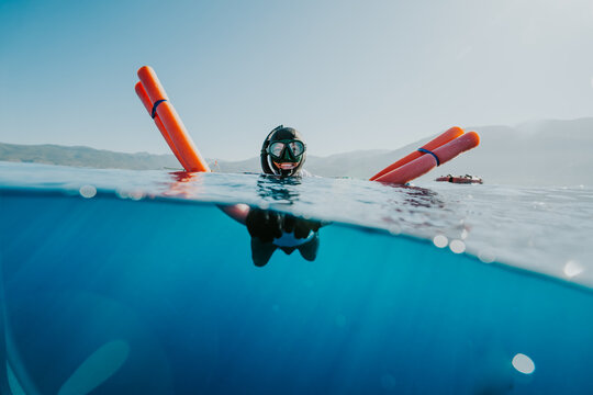 Freediver holding safety float during surface recovery