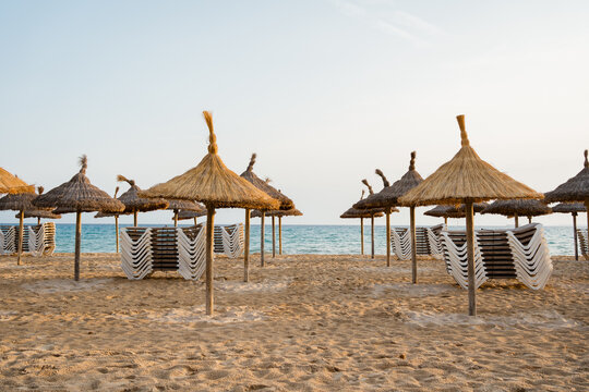 Beach Umbrellas and Deck Chairs Ready for a Relaxing Day
