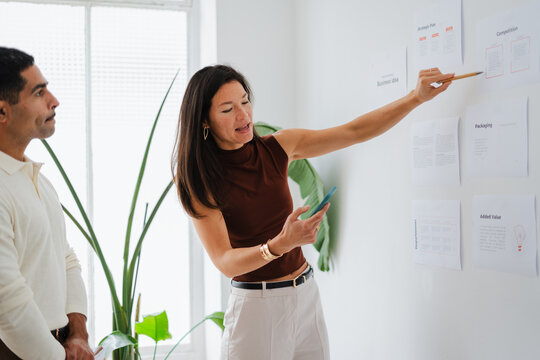 A woman briefs her team