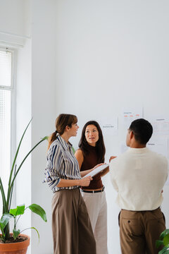 Colleagues discuss ongoing project