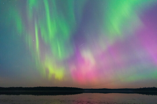 Starlight and Auroras Reflect on Little Kenosee Lake, Saskatchewan