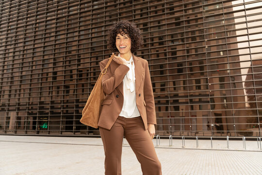 Smiling Woman Leaving Office